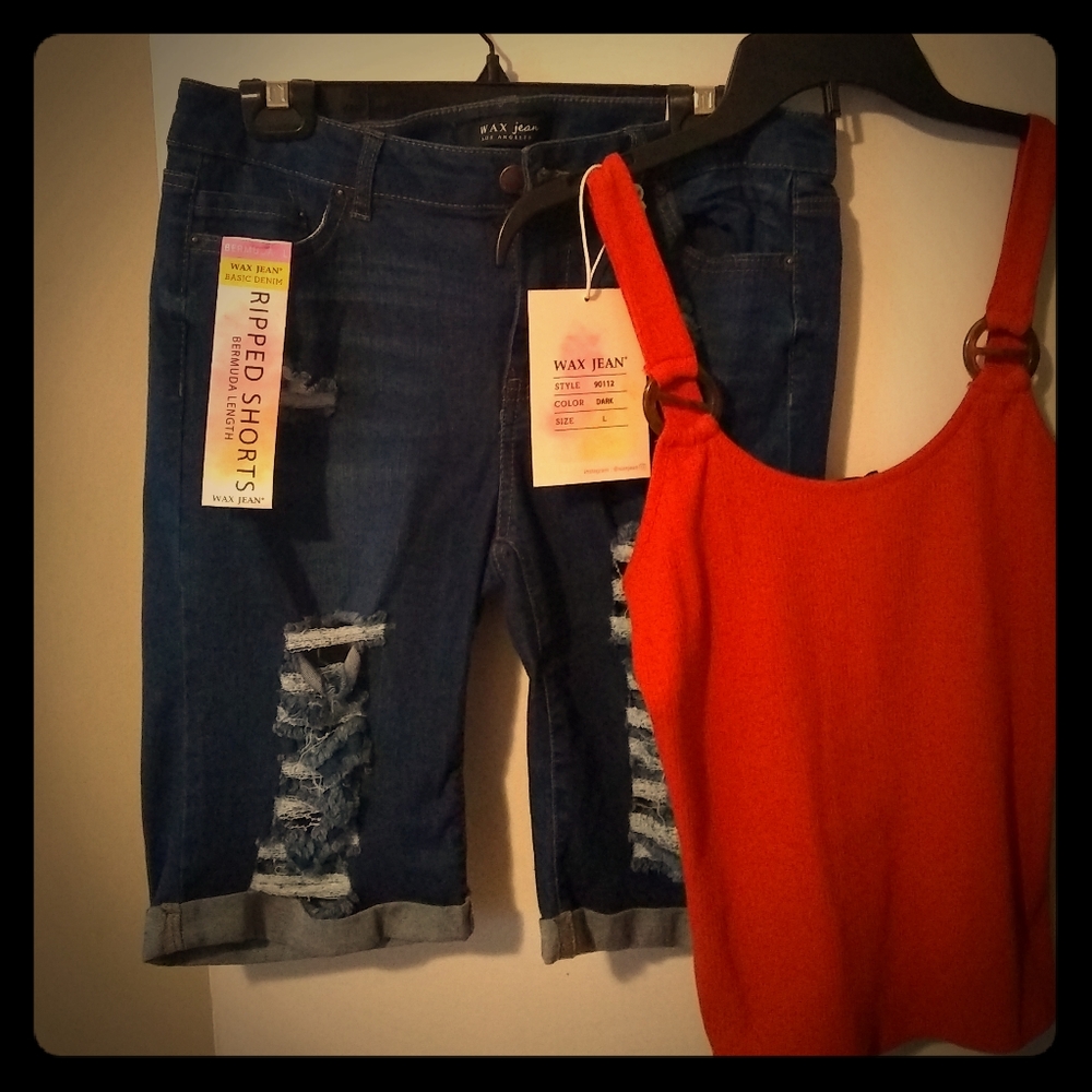 Cut up jean shorts size large with an orange tank